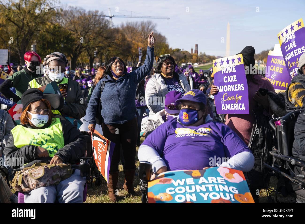 Washington, United States. 16th Nov, 2021. People shout in support during a rally in support of the care economy investments in the Build Back Better agenda hosted by the National Domestic Workers Alliance, MomsRising, and the Service Employees International Union (SEIU) on the National Mall in Washington DC on Tuesday, November 16, 2021. Photo by Sarah Silbiger/UPI Credit: UPI/Alamy Live News Stock Photo