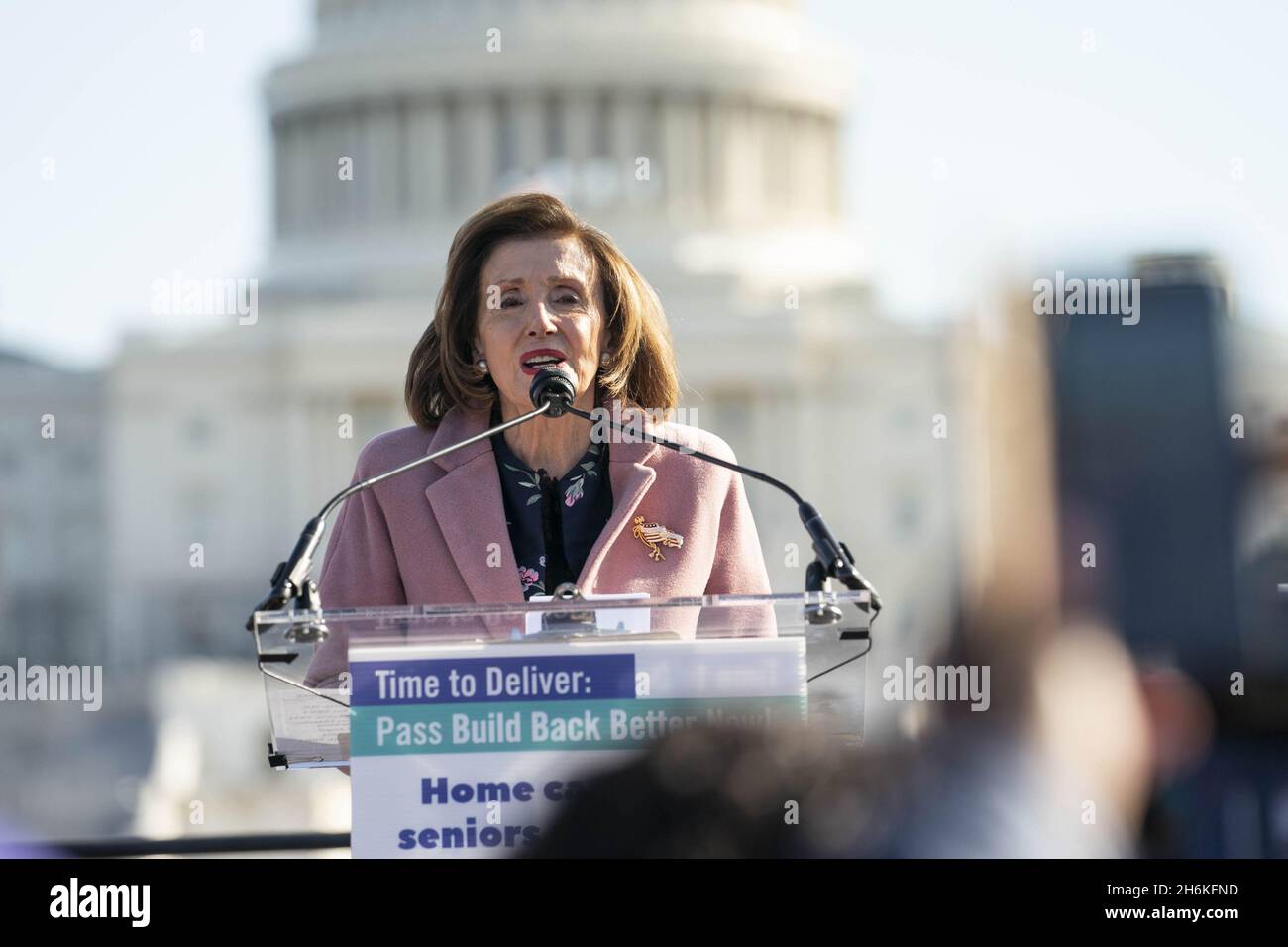 Washington, United States. 16th Nov, 2021. Speaker of the House Nancy Pelosi, D-CA, speaks during a rally in support of the care economy investments in the Build Back Better agenda hosted by the National Domestic Workers Alliance, MomsRising, and the Service Employees International Union on the National Mall in Washington DC on Tuesday, November 16, 2021. Photo by Sarah Silbiger/UPI Credit: UPI/Alamy Live News Stock Photo