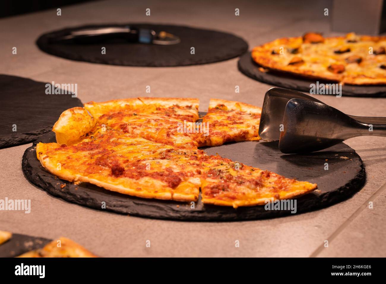 Delicious ham and cheese pizza to eat a portion. Stock Photo