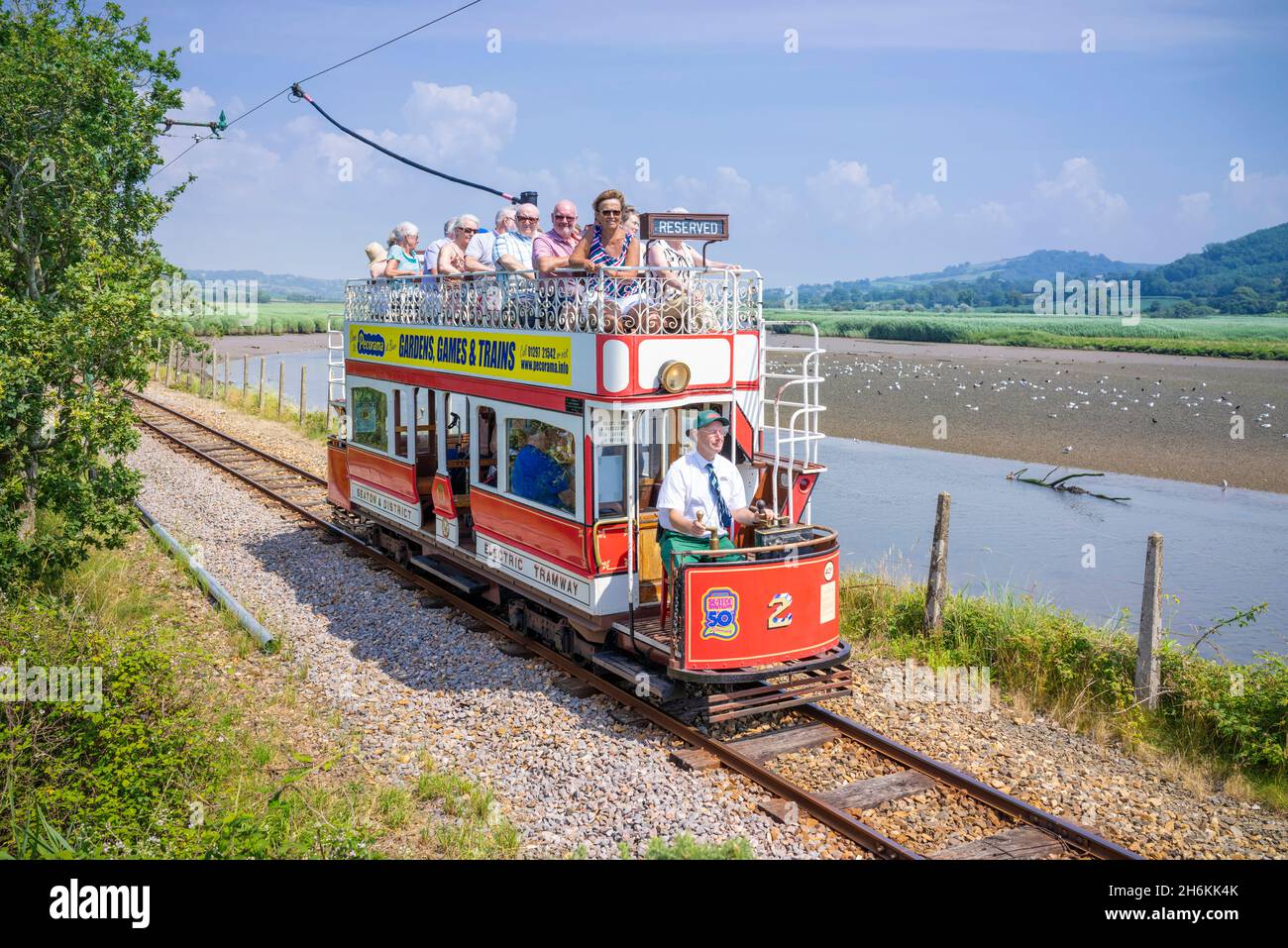 Historic tram on the track beside the Seaton wetlands on the historic Seaton tramway Seaton Devon England UK GB Europe Stock Photo