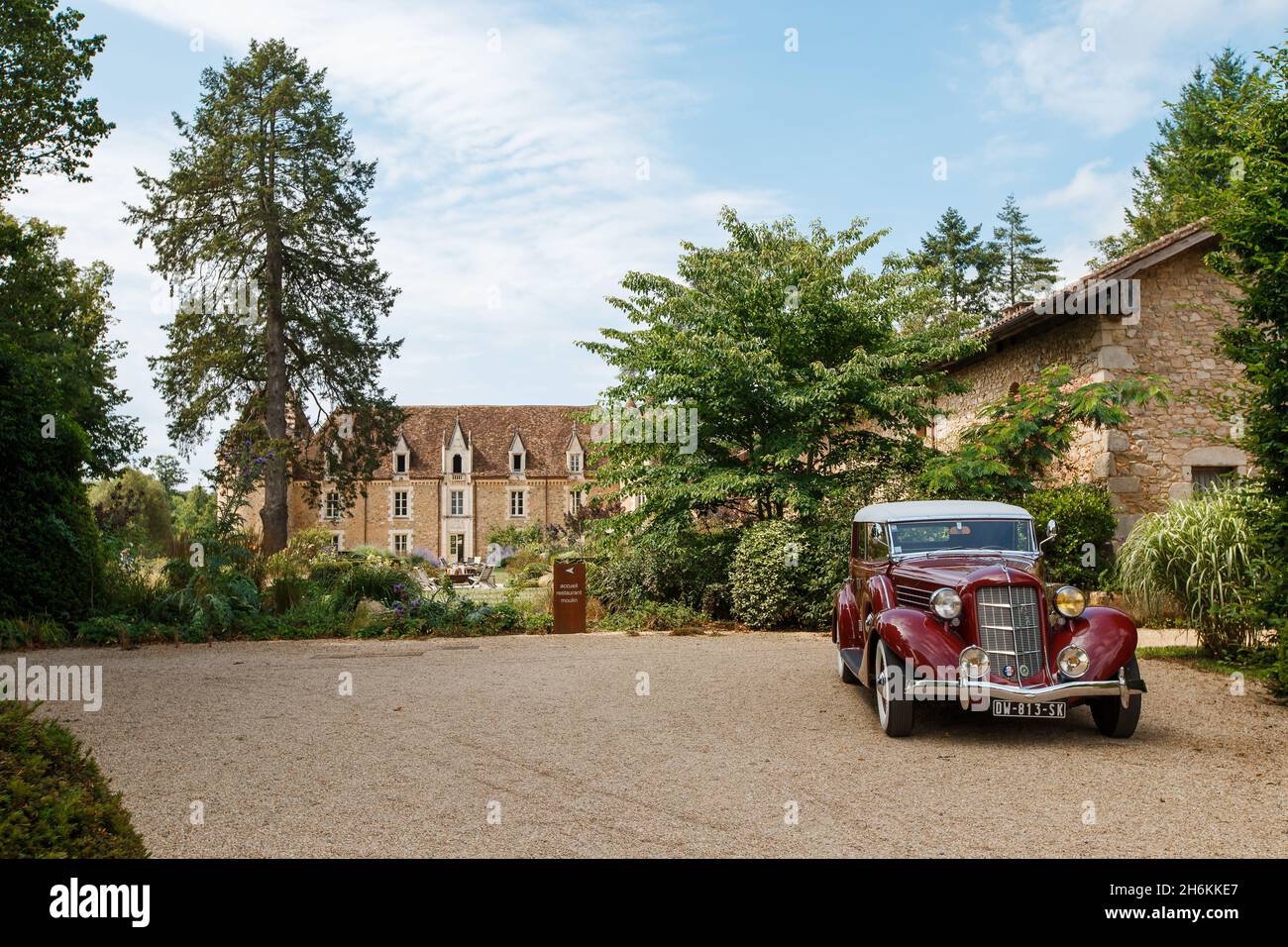 Bordeaux, France - 2019: Retro car Auburn 654 standing on beautiful background of old chateau. Luxury, expensive red automobile. Rare american car bra Stock Photo