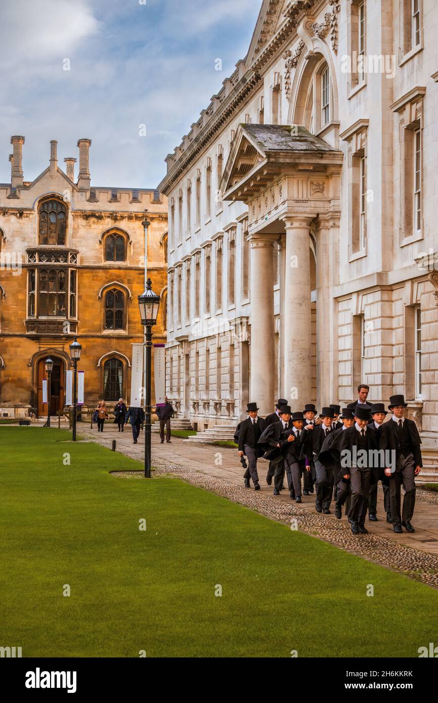 Kings College choir boys this formal uniform walking together beide the Gibbs building in Kings College Cambridge. Stock Photo