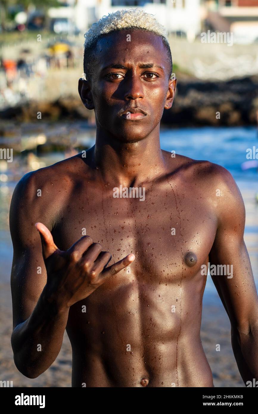 Young athletic model looking and posing at the photo with ok sign. Salvador Bahia Brazil. Stock Photo