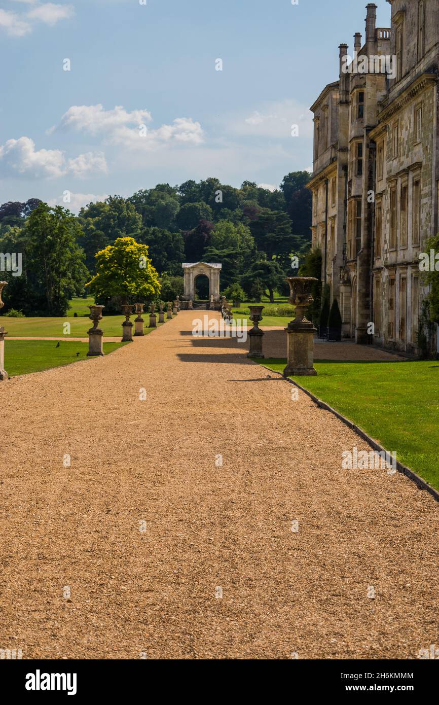 Country Manor house driveway looking to Palladian bridge at Wilton House Wilton near Salisbury in Wiltshire England Stock Photo