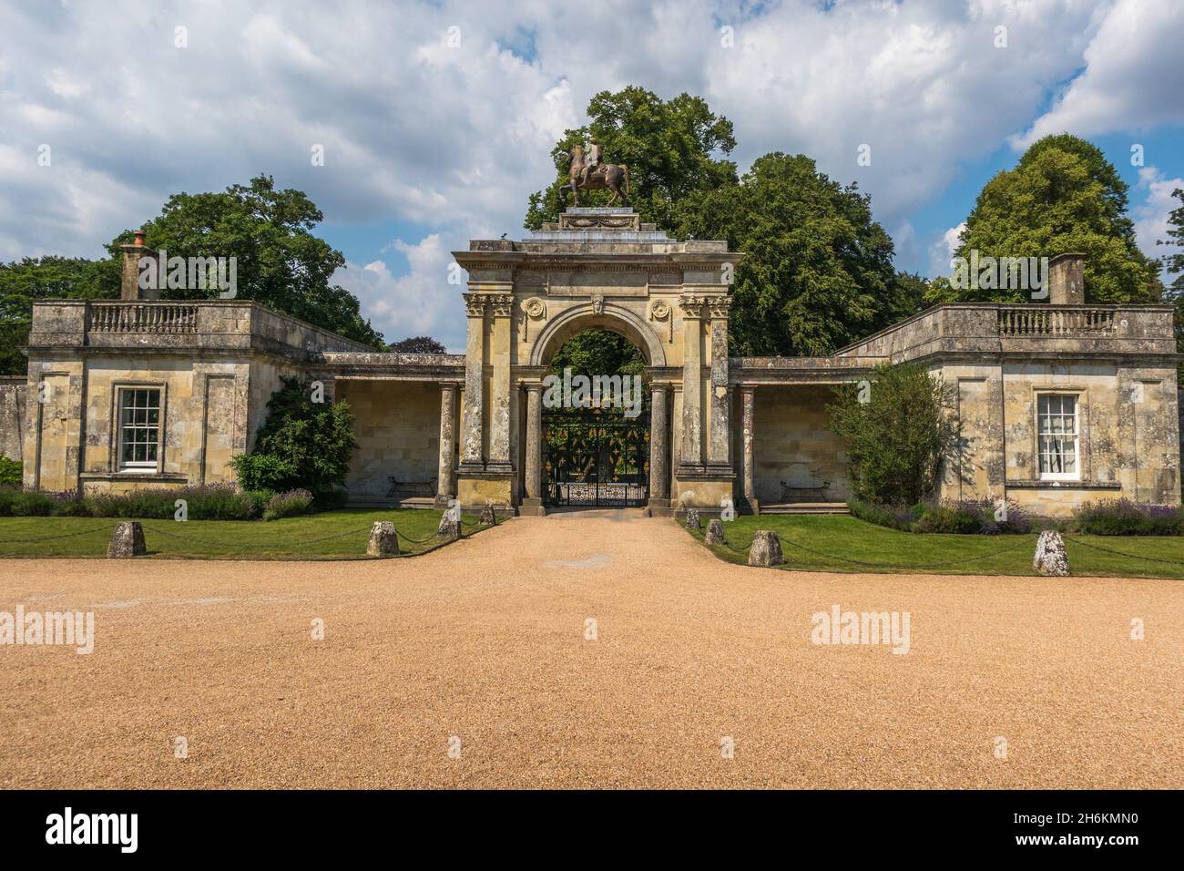 Entrance arched gate with Corinthian columns to Wilton House Wilton England with a statue of Marcus Aurelius on horseback and balustrade parapets Stock Photo
