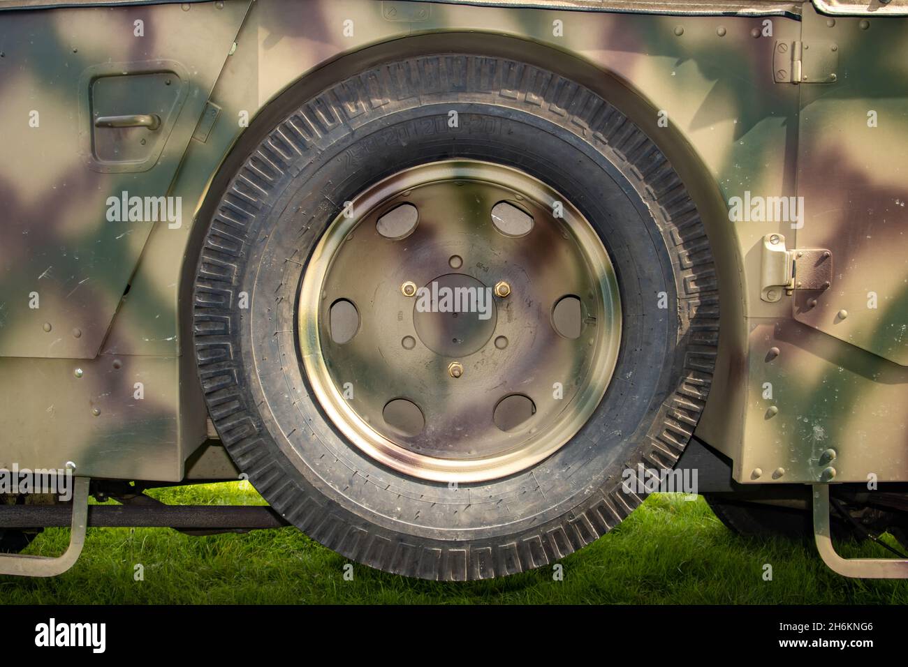 A spare wheel attached to the body of an retro  army vehicle Stock Photo