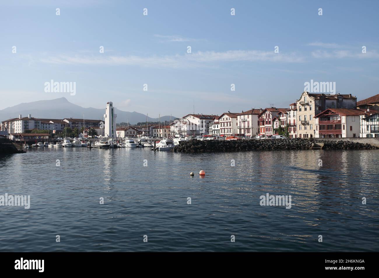 St Jean de Luz harbour, Ciboure and the pic de La Rhune in the background, Pays Basque, France. Stock Photo