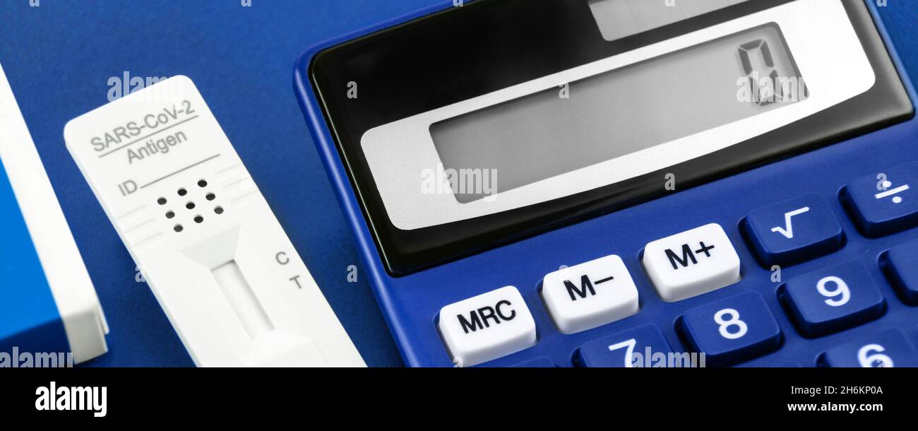 Corona Rapid Antigen Test and blue calculator Stock Photo Alamy