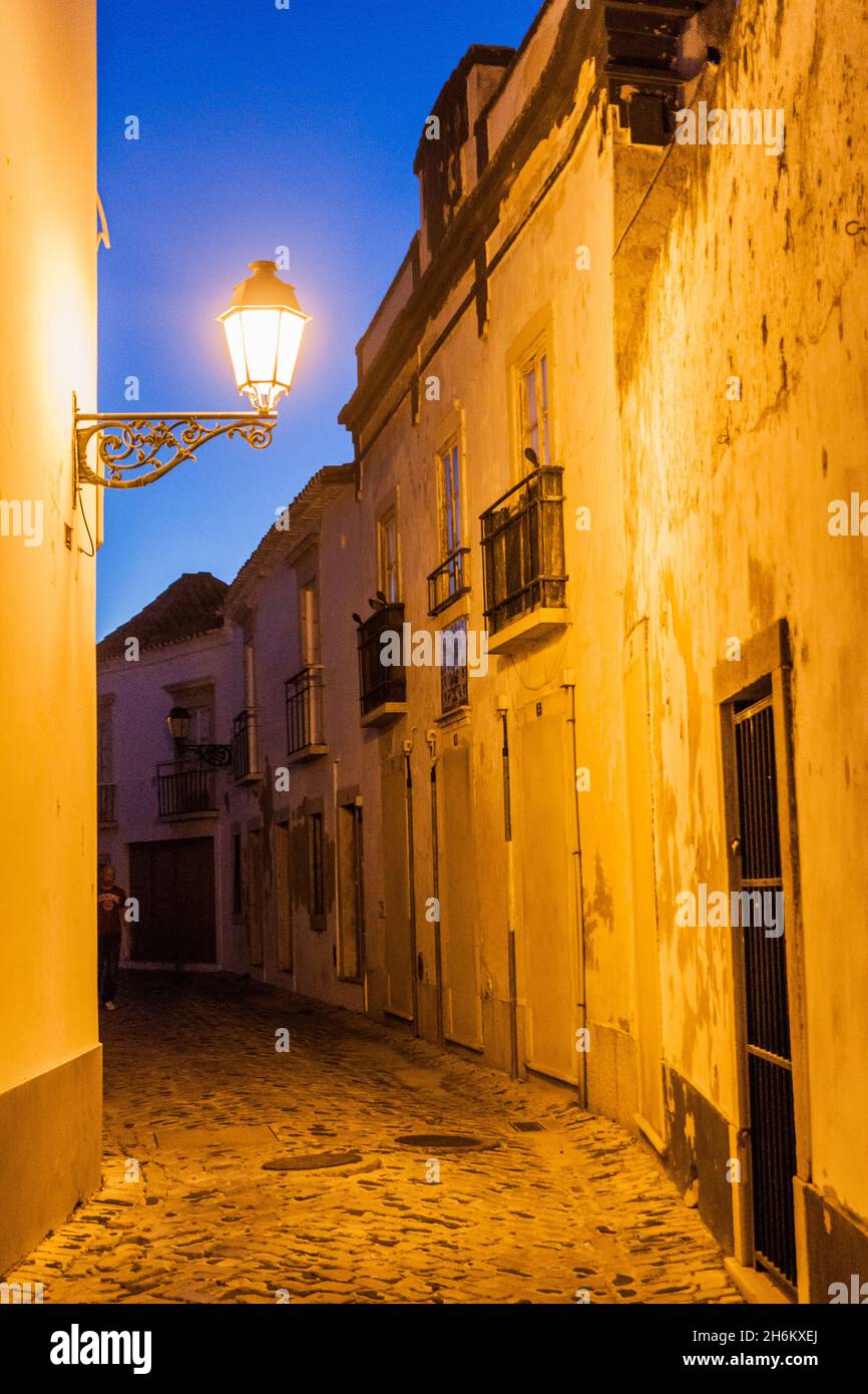 Evening view of a street in the Old Town Cidade Velha of Faro, Portugal. Stock Photo