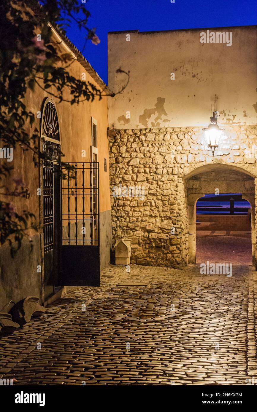 Evening view of a gate to the Old Town Cidade Velha of Faro, Portugal. Stock Photo