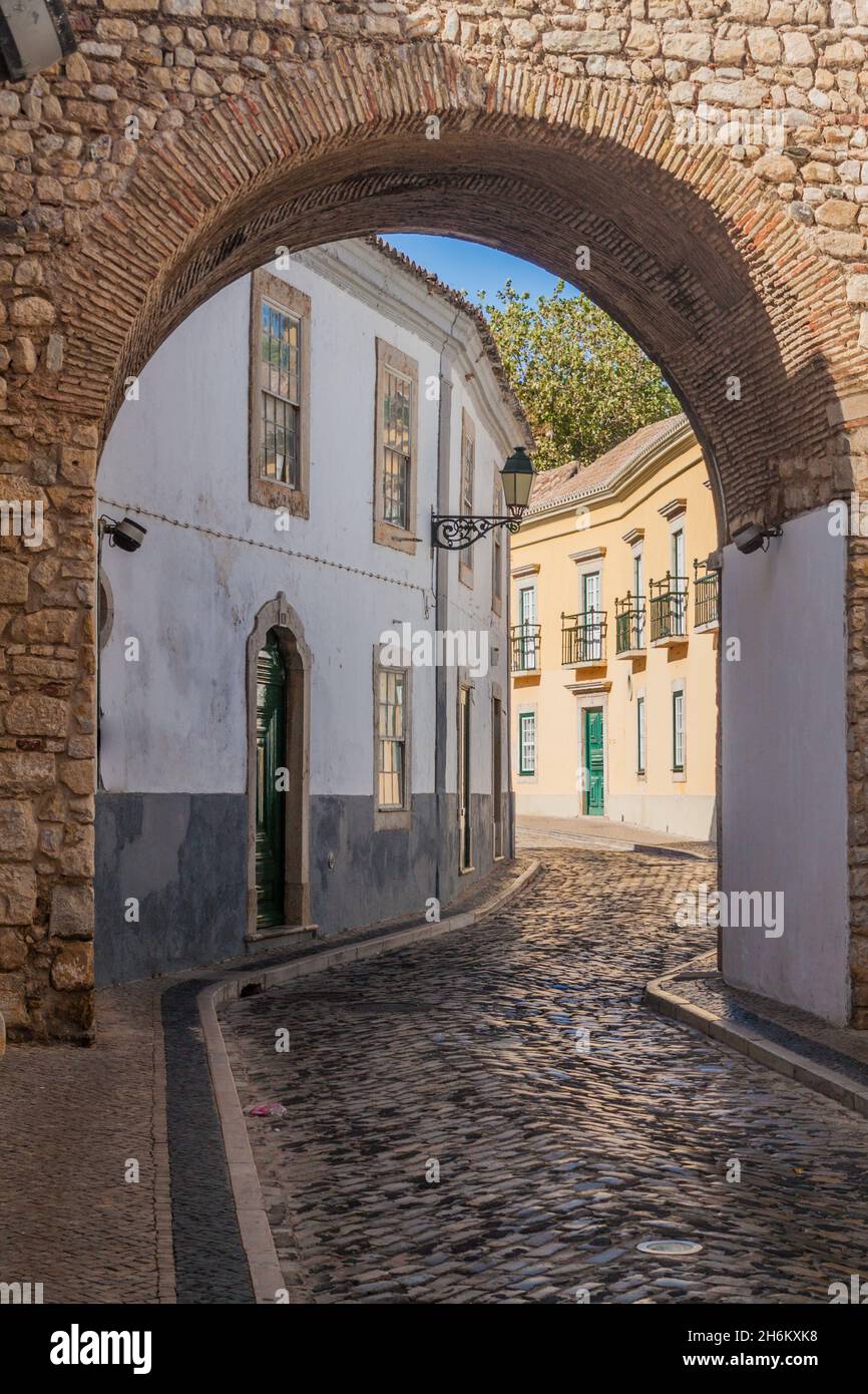 Narrow street in the Old Town Cidade Velha of Faro, Portugal. Stock Photo