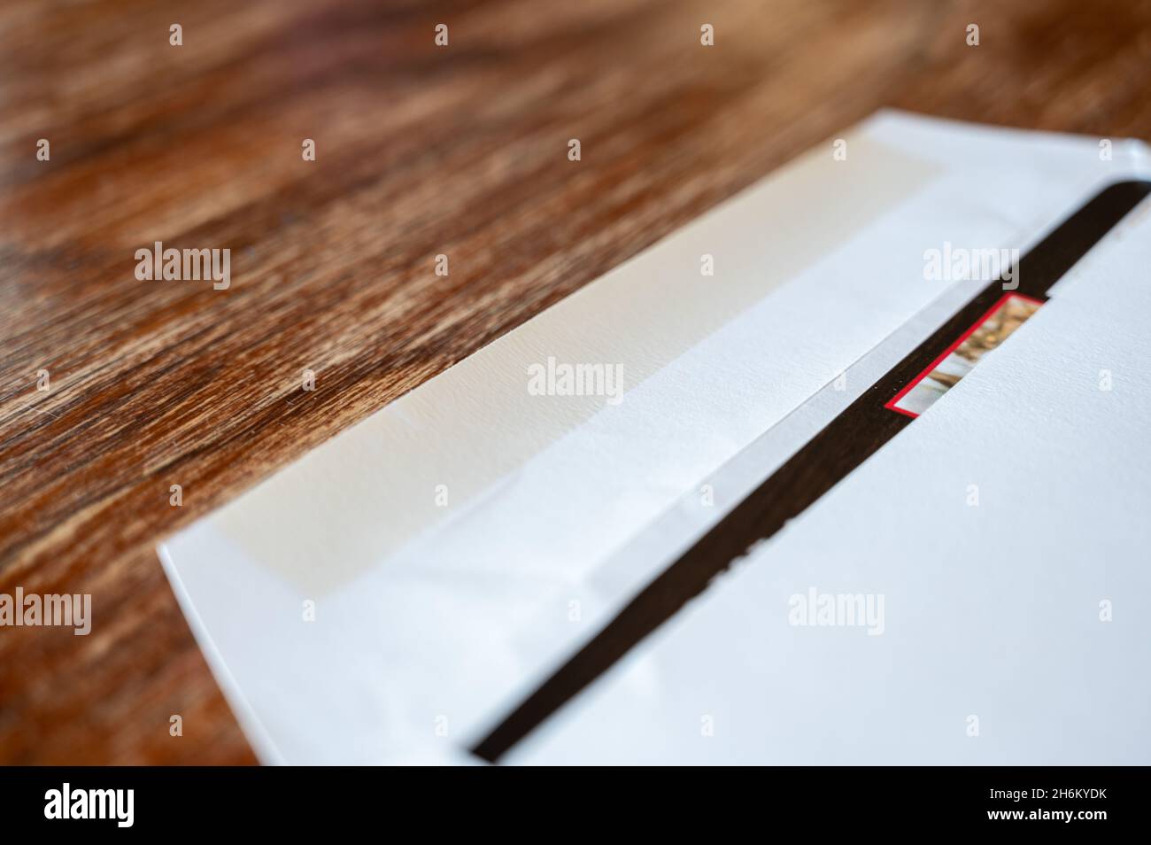 blank envelope ready to be sealed and sent in the mail. Dark colored