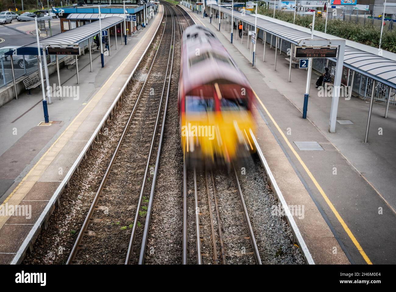 Speeding train going through station (motion blur) Stock Photo