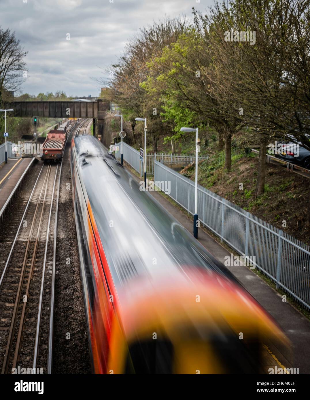 Speeding train going through station (motion blur) Stock Photo