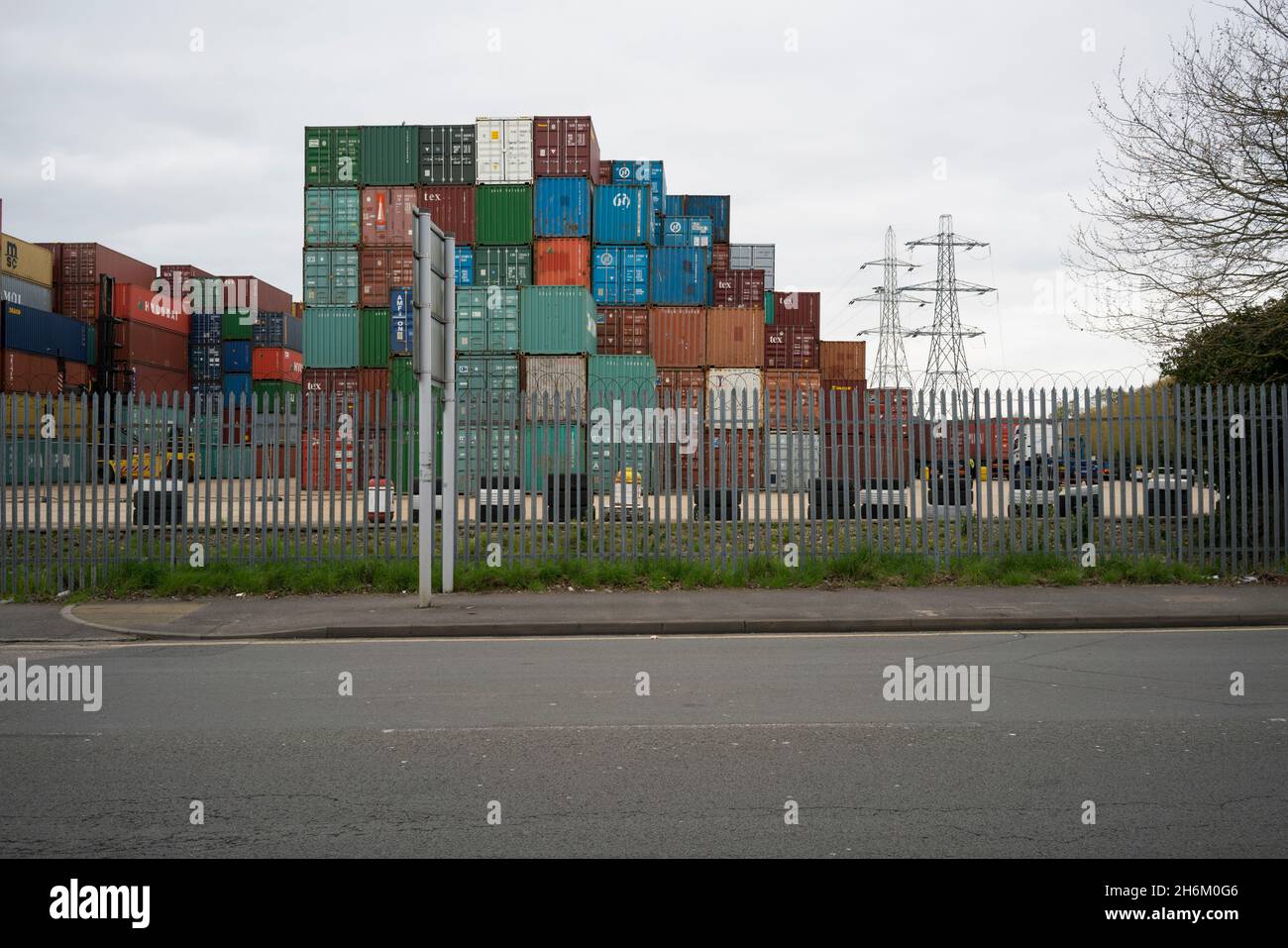 Shipping containers stacked in a holding zone Stock Photo