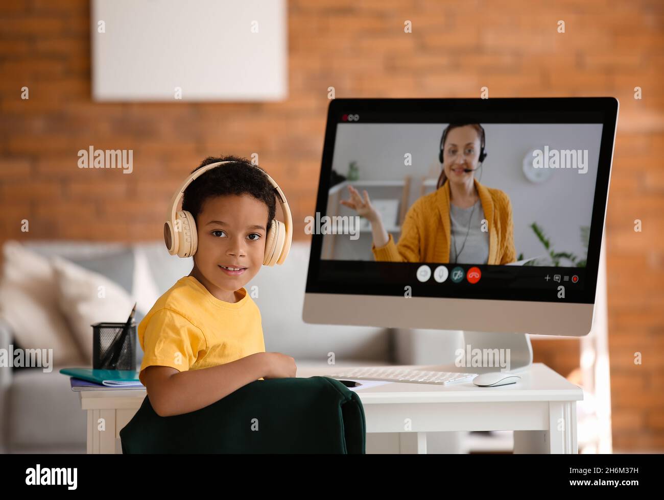 Little African-American boy studying online at home Stock Photo