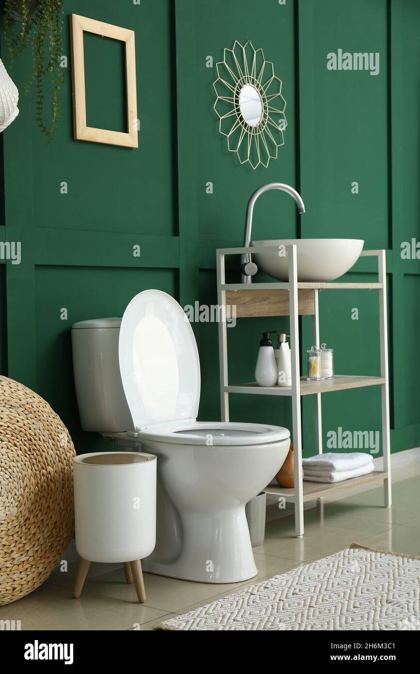 White toilet bowl in interior of modern restroom Stock Photo - Alamy
