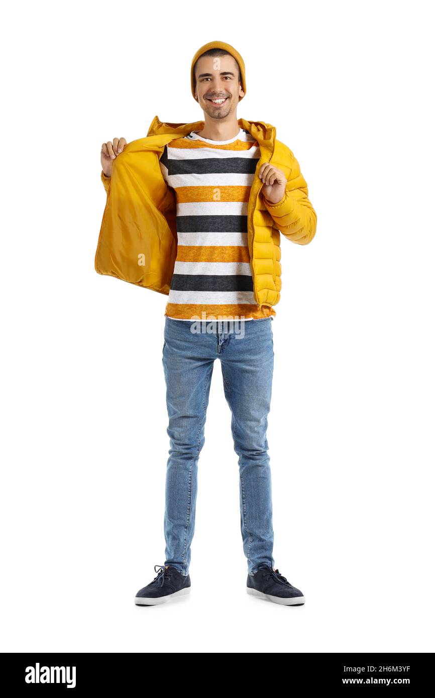 Handsome young man in yellow hat and jacket on white background Stock