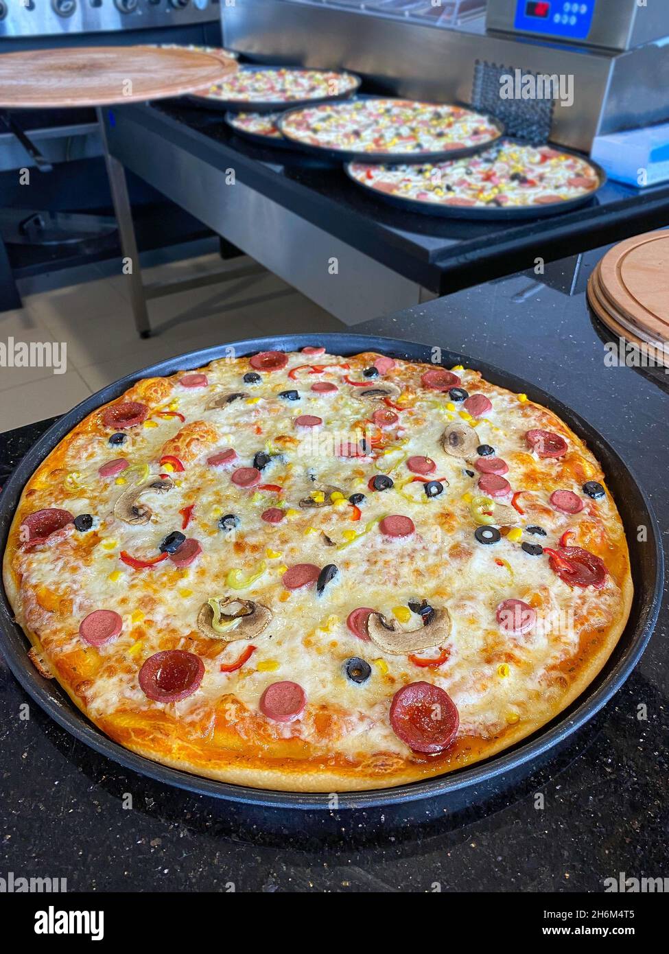 Handmade pizza cooked by a pizza master in Turkey Stock Photo