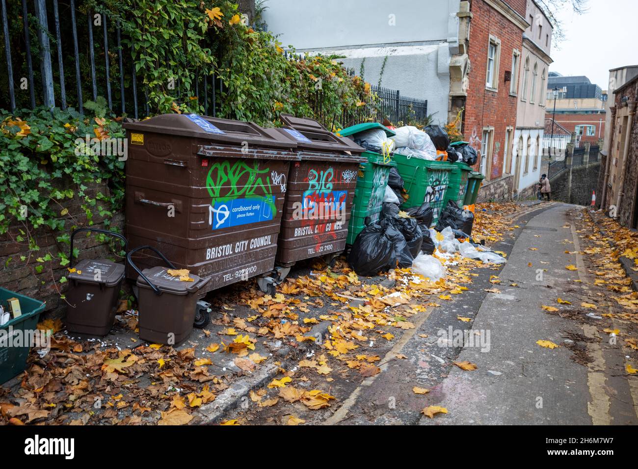 Overflowing commercial wheelie bins Lower Church Lane, Bristol, UK Stock Photo