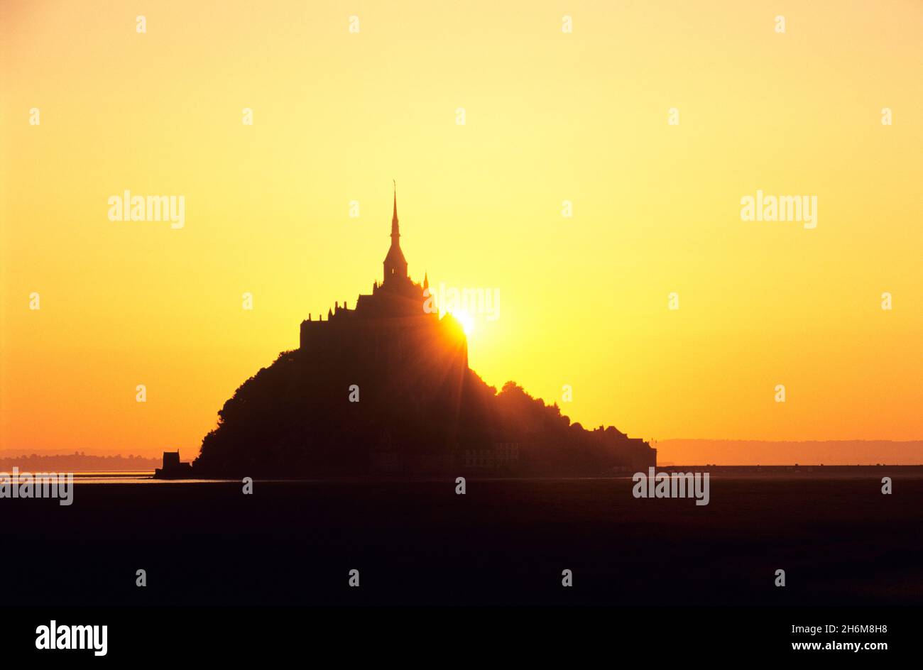 Silhouette of Mont Saint Michel At Sunrise, Mont Saint Michel, Normandy, France Stock Photo