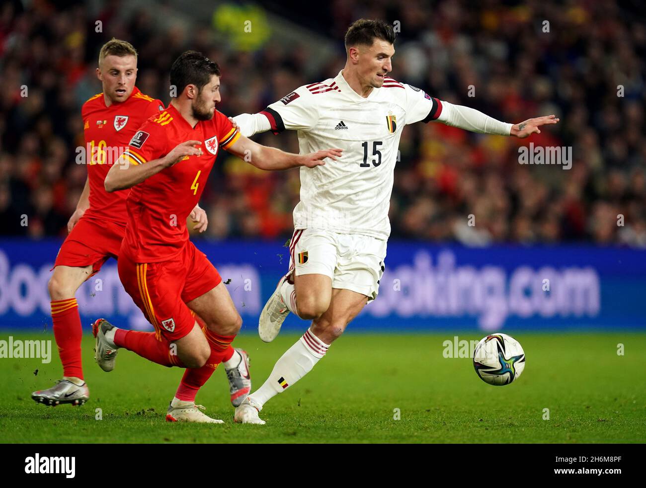 Wales' Ben Davies (left) and Belgium's Thomas Meunier battle for the ball during the FIFA World Cup Qualifying match at the Cardiff City Stadium, Cardiff. Picture date: Tuesday November 16, 2021. Stock Photo