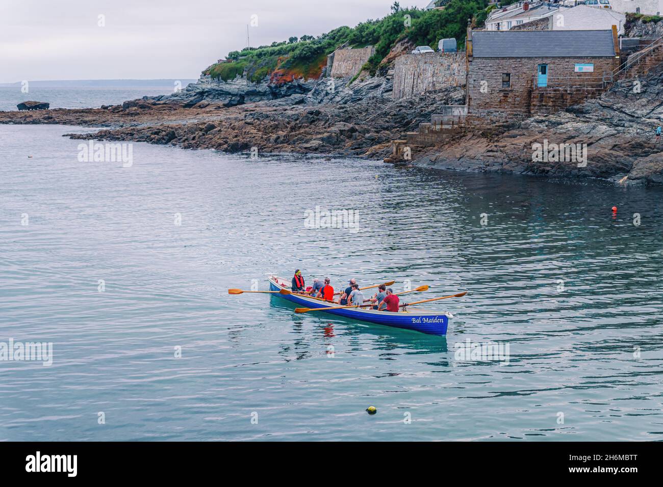 Cornish tradition of gig rowing being practiced at Porthleven, Cornwall Stock Photo
