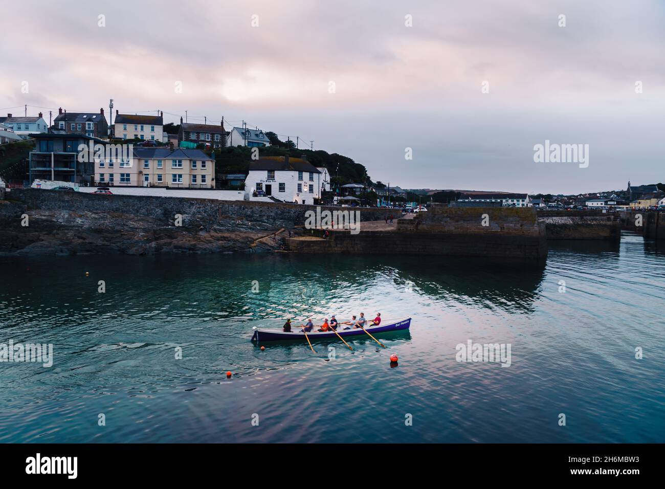 Cornish tradition of gig rowing being practiced at Porthleven, Cornwall Stock Photo