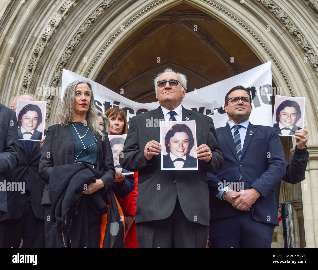 London, UK. 16th Nov, 2021. Retired police officer, John Murray (C) holds a portrait of Yvonne Fletcher outside the Royal Courts of Justice. Saleh Ibrahim Mabrouk, a Libyan man close to Gaddafi, has been found jointly responsible for the fatal shooting of police officer Yvonne Fletcher outside the Libyan Embassy in 1984, in a civil case brought by her former colleague and friend, John Murray. (Photo by Vuk Valcic/SOPA Images/Sipa USA) Credit: Sipa USA/Alamy Live News Stock Photo