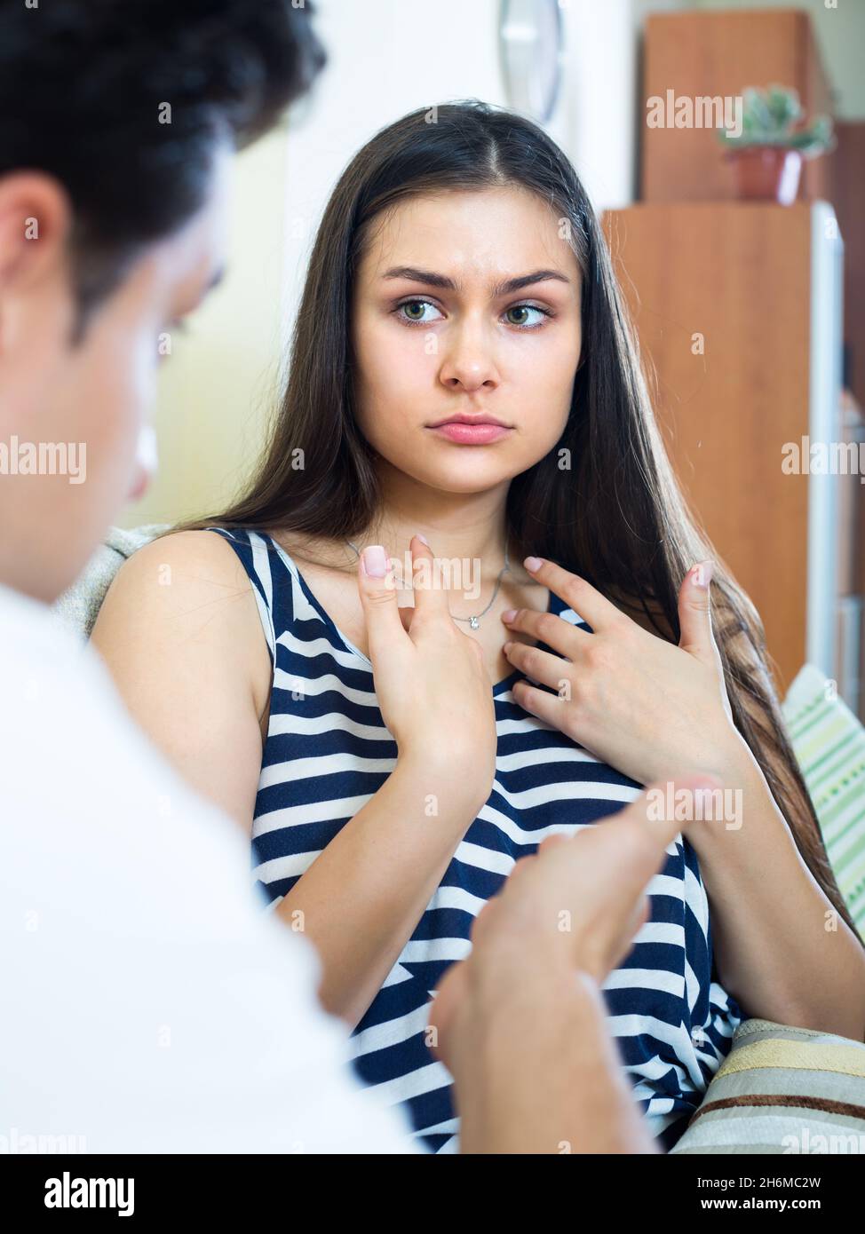 Quarrel between young spouses at home. Stock Photo