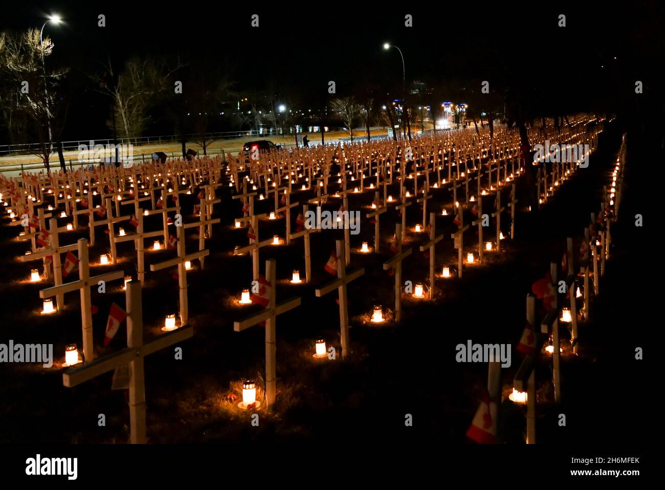 CALGARY, CANADA Nov 12, 2021 Rows of crosses and a candle light