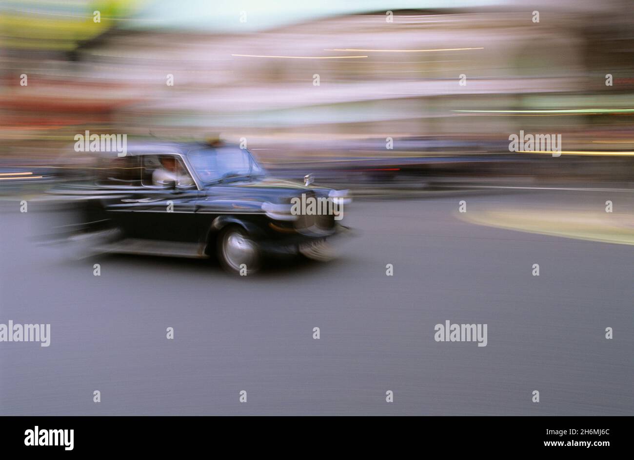 Blurred Motion of Taxi on Street at Piccadilly Circus London, England Stock Photo