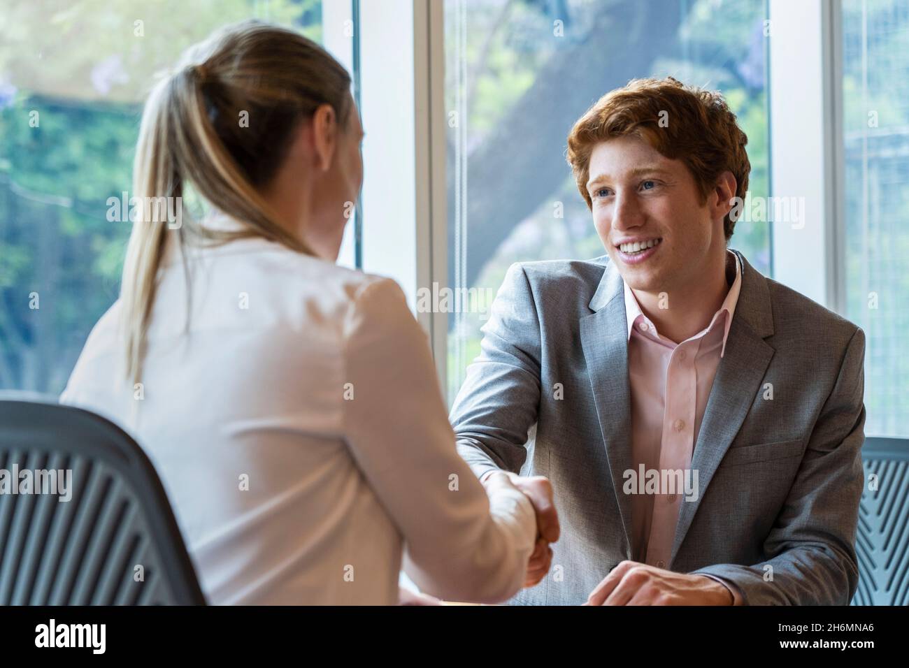 Man woman handshake office desk hi-res stock photography and images - Alamy