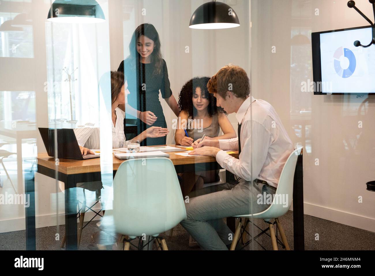 Business people working together in board room Stock Photo