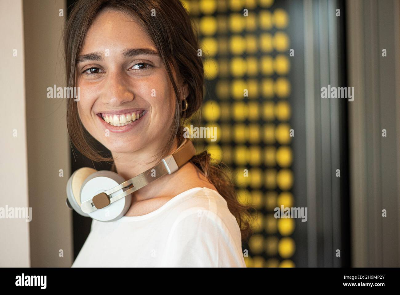 Portrait of smiling young woman in office Stock Photo