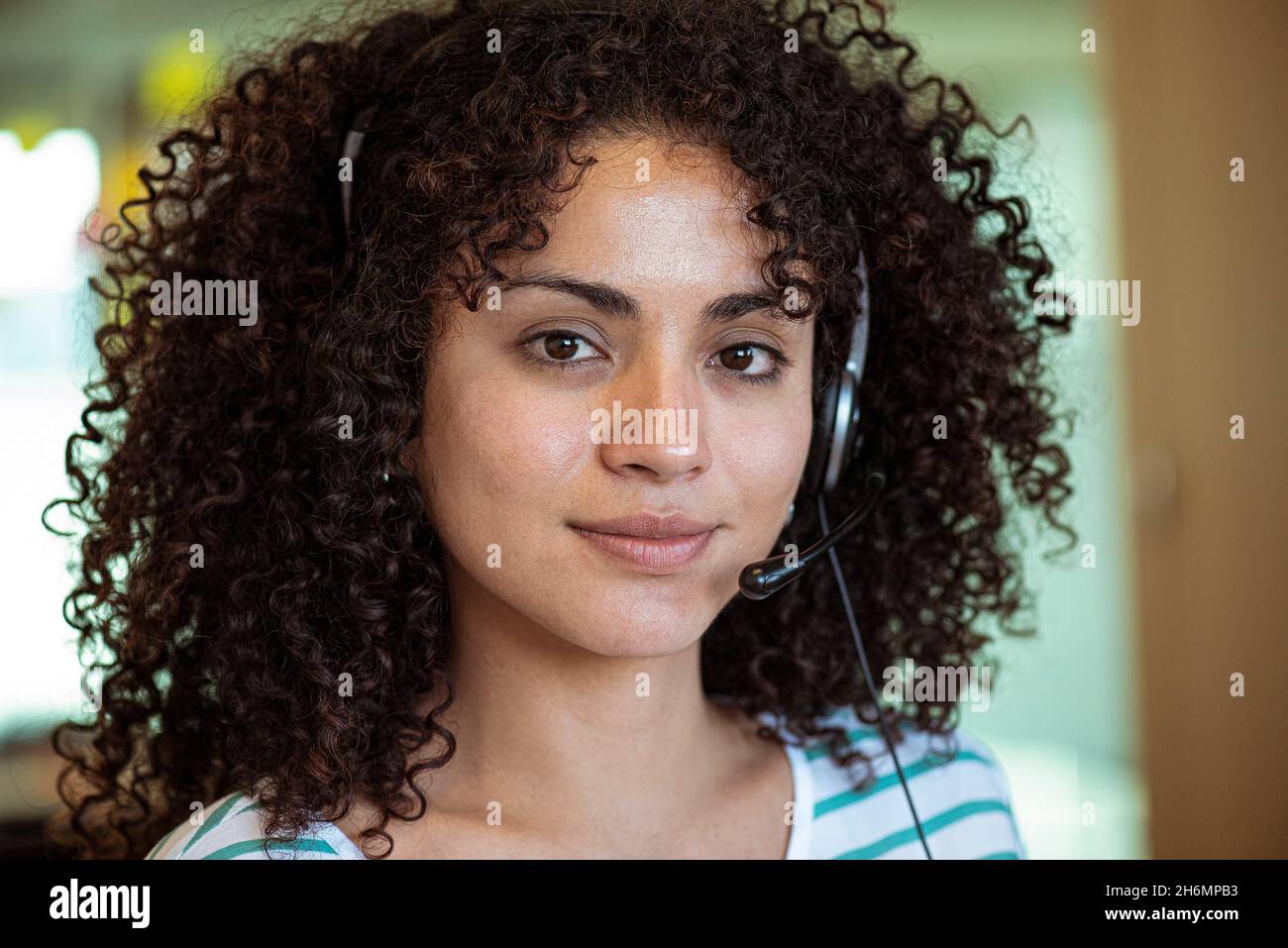 Portrait of young woman wearing headset Stock Photo