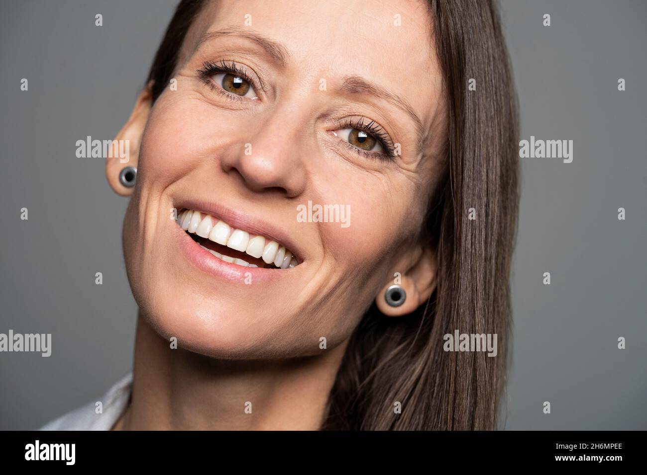 Portrait of smiling mature woman in office Stock Photo - Alamy