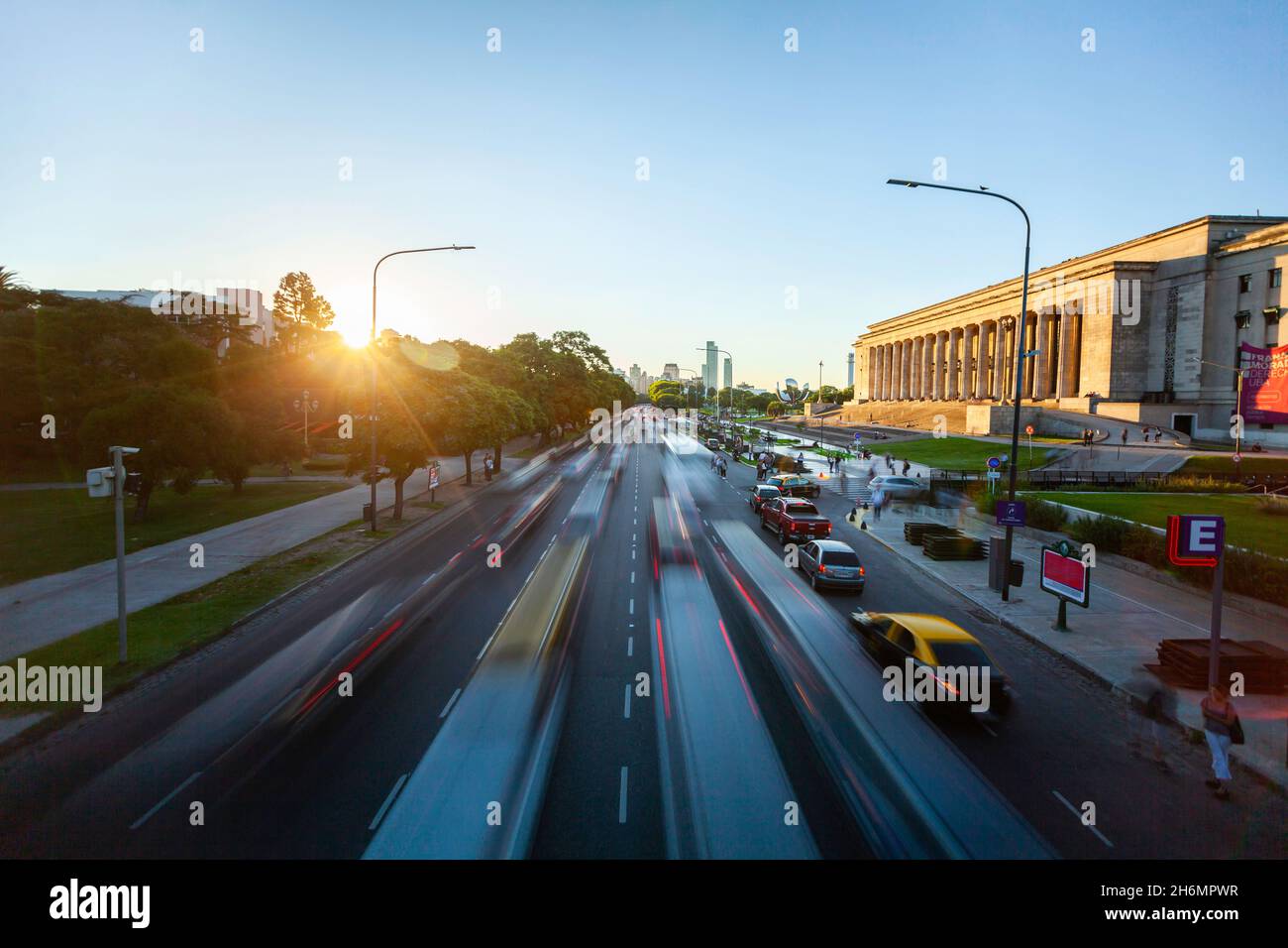View of traffic driving on street with Law Faculty building and University of Buenos Aires in city Stock Photo