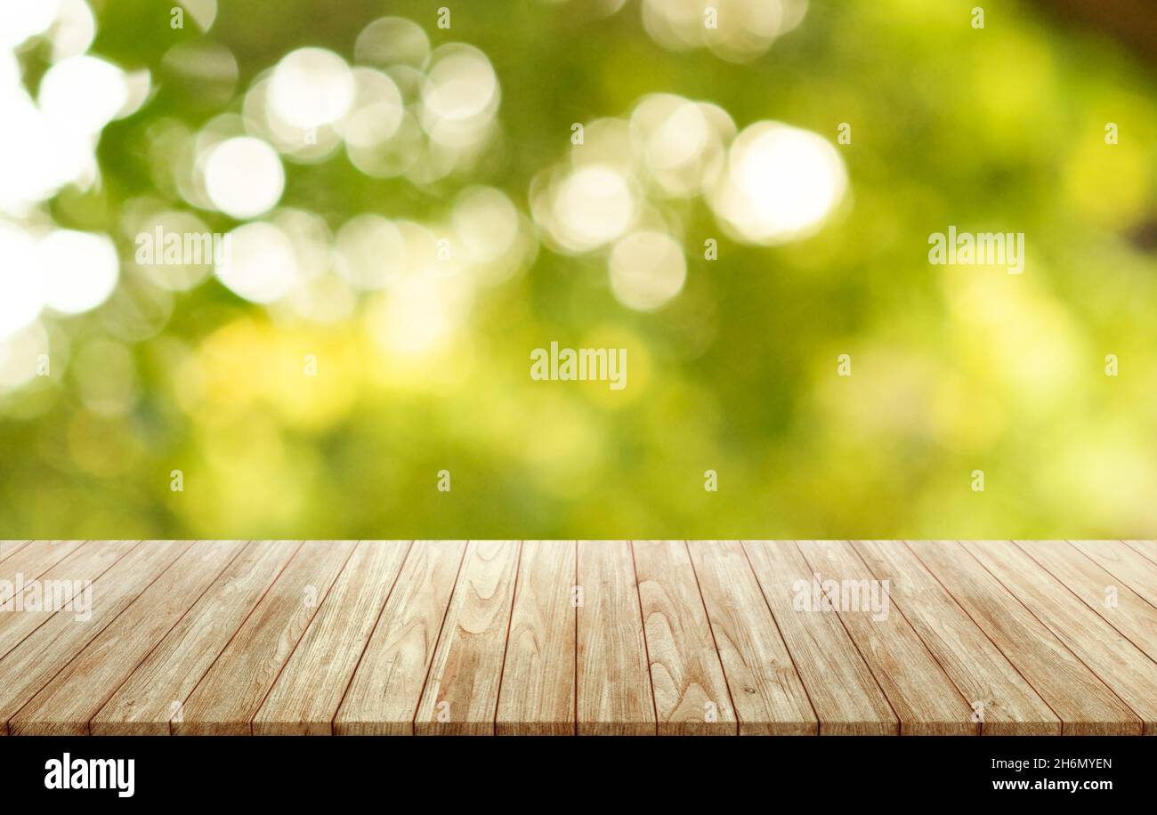 Empty wooden table on outdoor forest blurred background, assembly, product display exhibition. Stock Photo
