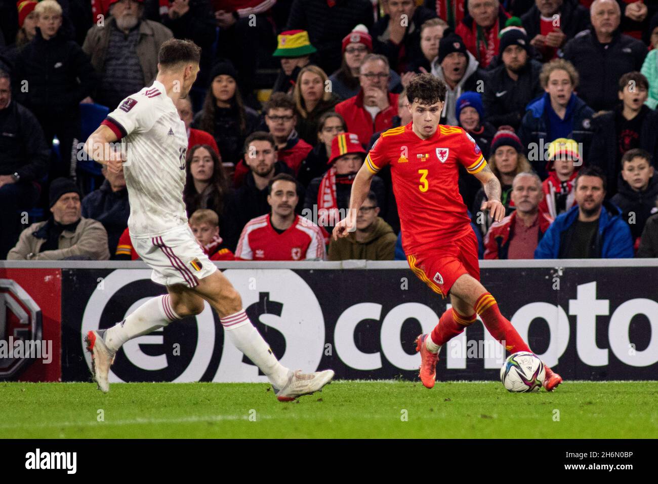 Cardiff, UK. 16th Nov, 2021. Neco Williams of Wales in action against Thomas Meunier of Belgium. Wales v Belgium in a 2022 FIFA World Cup Qualifier at the Cardiff City Stadium on the 16th November 2021. Credit: Lewis Mitchell/Alamy Live News Stock Photo