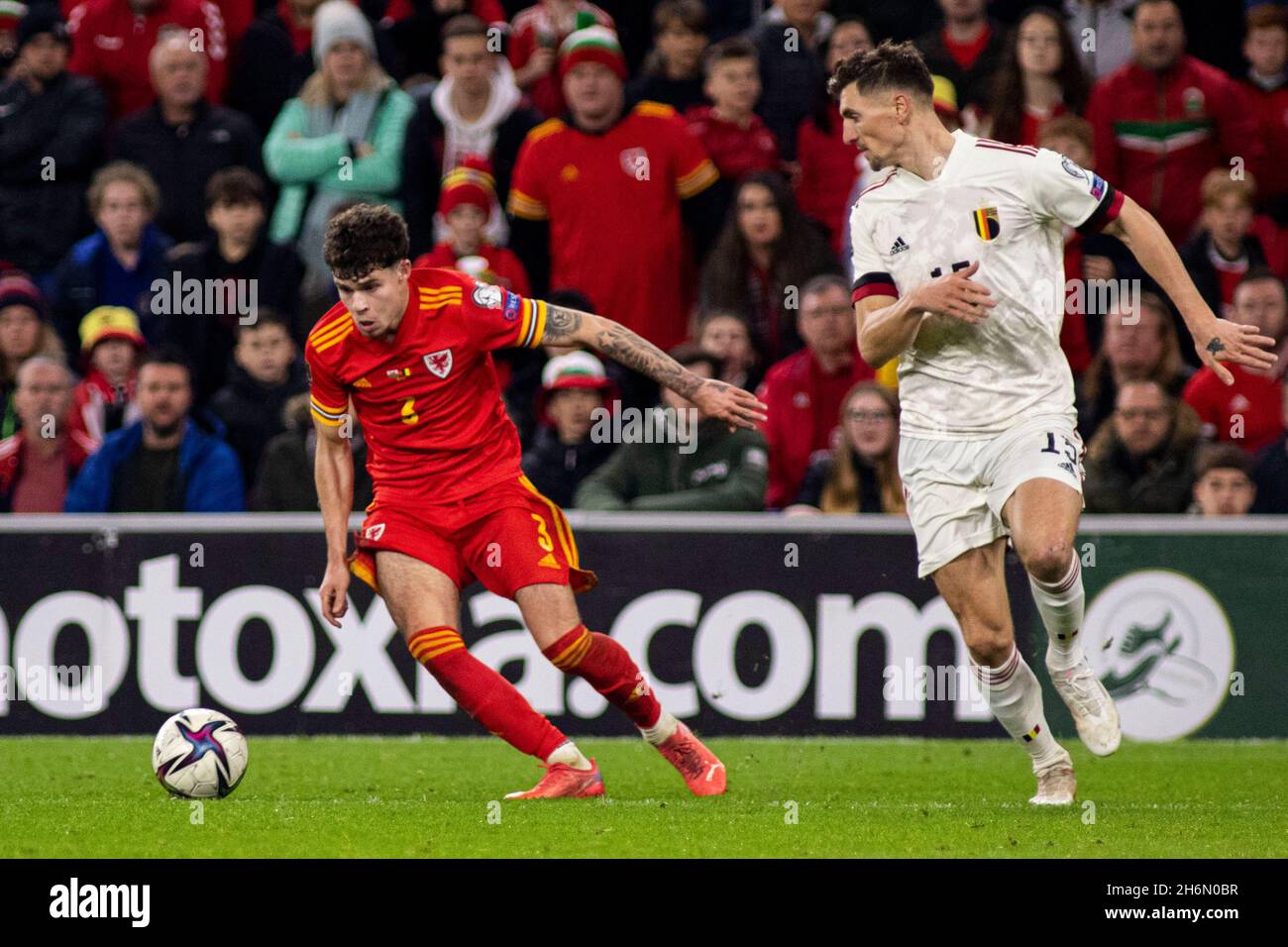 Cardiff, UK. 16th Nov, 2021. Neco Williams of Wales in action against Thomas Meunier of Belgium. Wales v Belgium in a 2022 FIFA World Cup Qualifier at the Cardiff City Stadium on the 16th November 2021. Credit: Lewis Mitchell/Alamy Live News Stock Photo