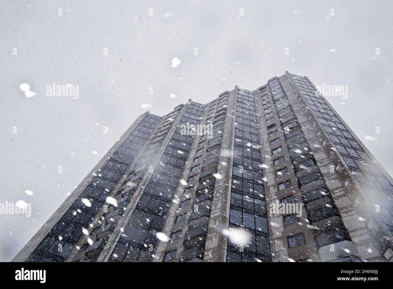 The Estuaire III condominium complex seen through falling snow in