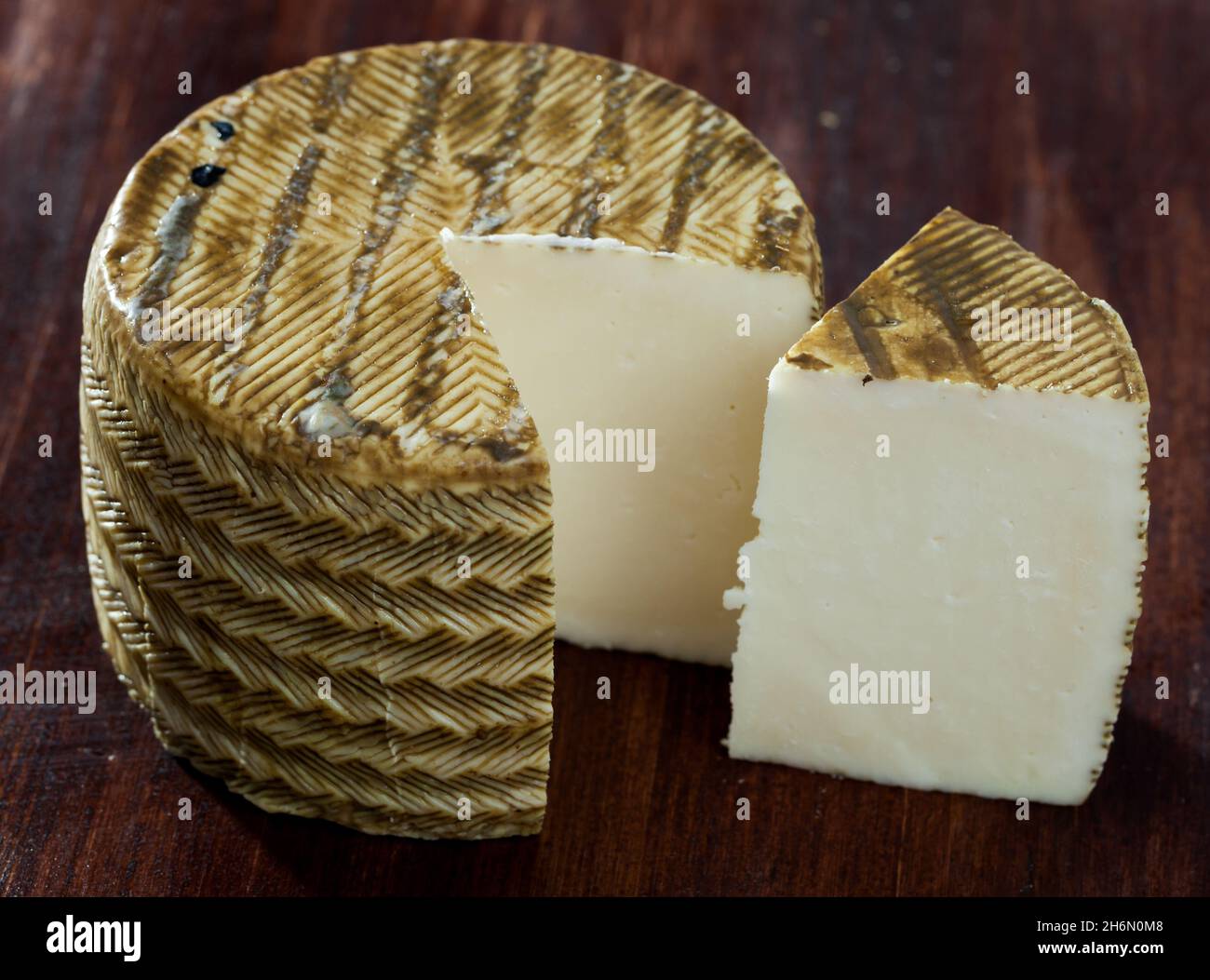 Spanish queso mezcla with cut piece Stock Photo Alamy