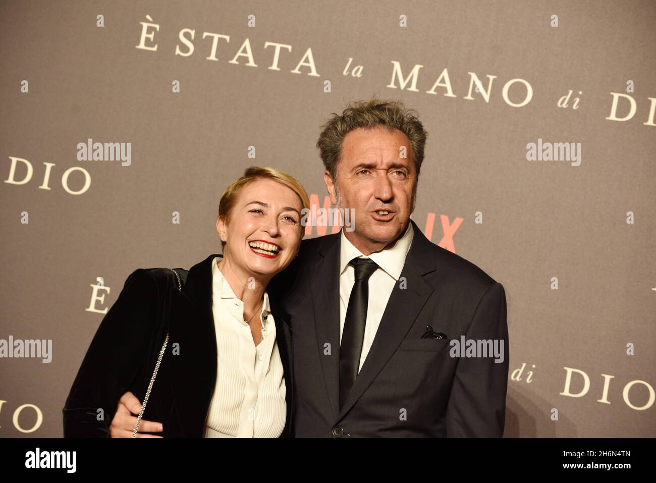 Naples, Italy. 16th Nov, 2021. The director Paolo Sorrentino (R) side and on (L) side his wife Daniela D'Antonio, on the red carpet during the presentation of his last film ' E' stata la mano di Dio'. The last work of Sorrentino presented at Metropolitan Cinema of Naples, was candidate for 2022 Oscar Prize as the best foreign film. (Photo by Pasquale Gargano/Pacific Press) Credit: Pacific Press Media Production Corp./Alamy Live News Stock Photo