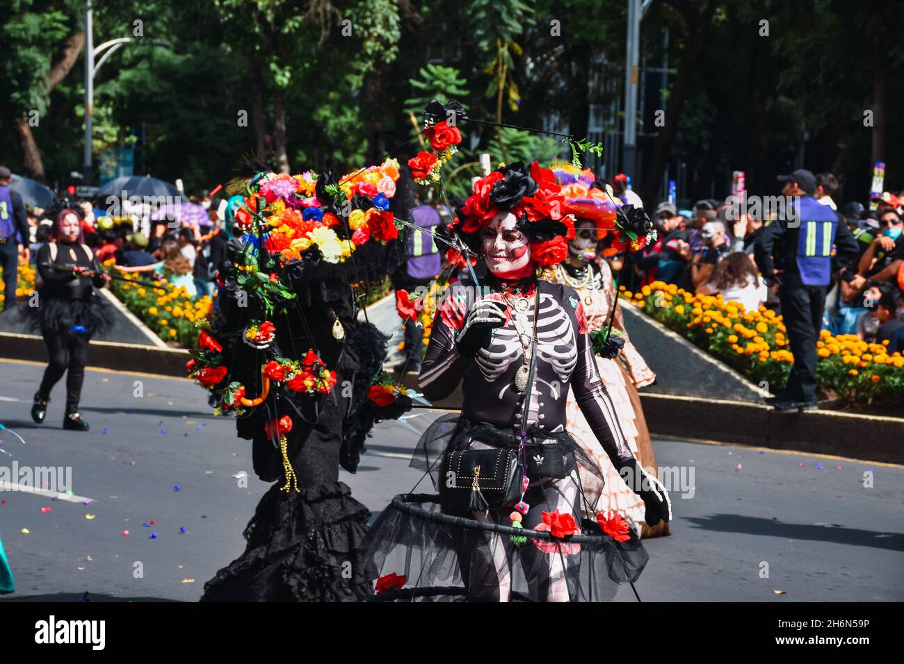 Mexico City, Mexico ; October 31 2021:  Day of the Dead, people in disguise representing catrina during the Day of the Dead parade Stock Photo