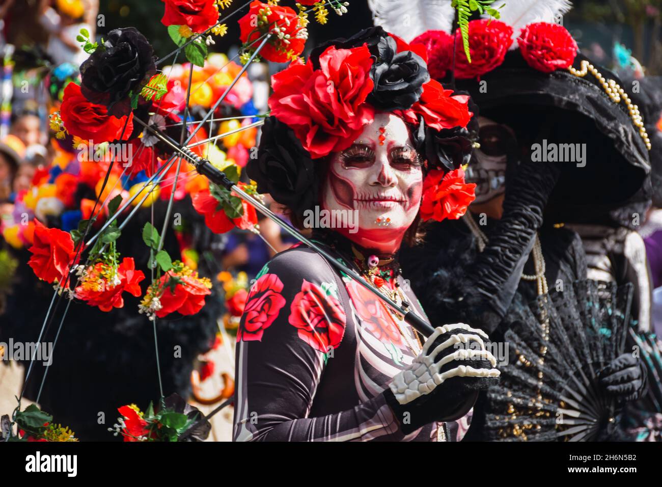 Mexico City, Mexico ; October 31 2021:  Day of the Dead, people in disguise representing catrina during the Day of the Dead parade Stock Photo