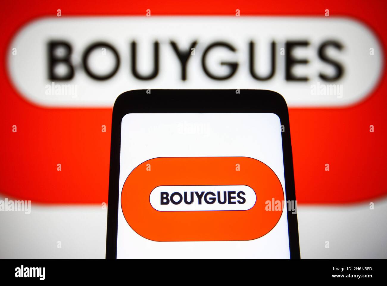 Ukraine. 16th Nov, 2021. In this photo illustration, a Bouygues S.A. logo is seen on a smartphone screen and in the background. Credit: SOPA Images Limited/Alamy Live News Stock Photo
