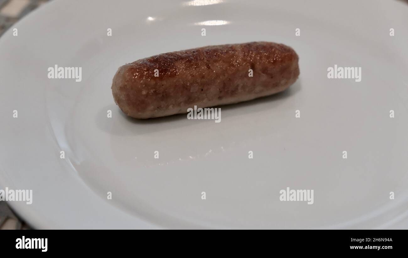 Grilled Pork Sausage on a Plate Stock Photo