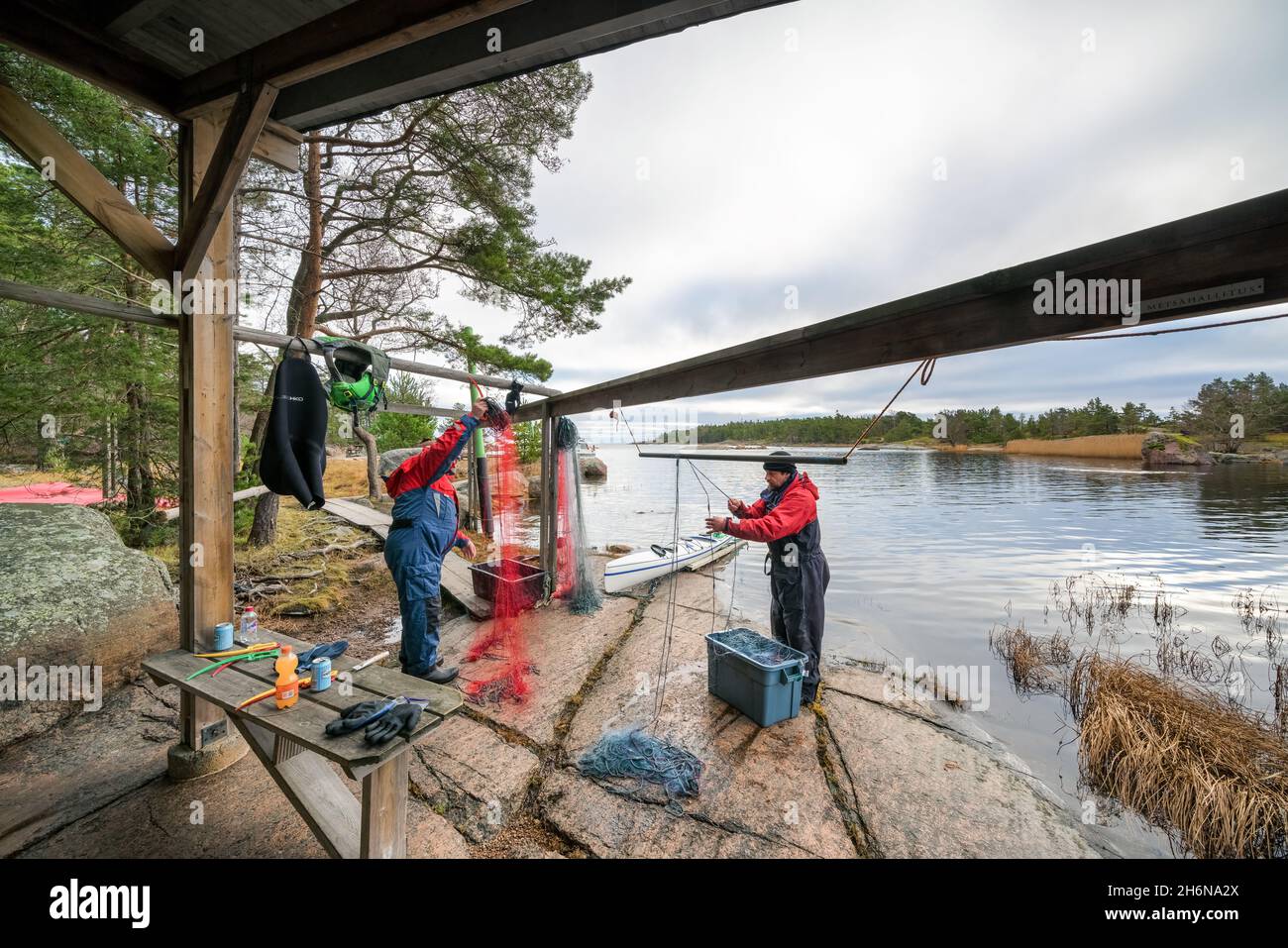 Cleaning fishing nets at Ulko-Tammio island, Hamina, Finland Stock Photo
