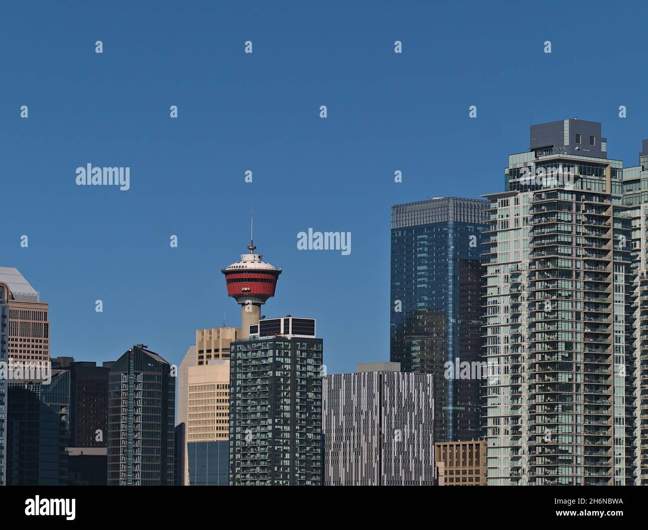 Close-up view of the modern skyline of Calgary downtown in Alberta, Canada on sunny day in autumn season with office and residential skyscrapers. Stock Photo